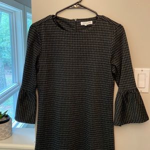 Houndstooth dress with ruffled long sleeve